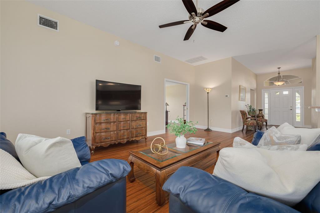 1701 Westerham Loop Trinity, FL 34655 - Photo 25 of 40 a living room with furniture and a flat screen tv