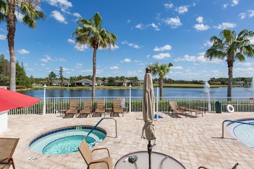 1701 Westerham Loop Trinity, FL 34655 - Photo 40 of 40 a view of a lake with couches chairs