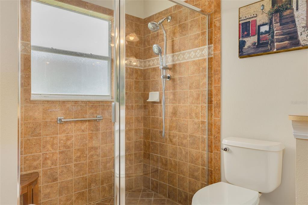 1701 Westerham Loop Trinity, FL 34655 - Photo 10 of 40 a bathroom with a toilet and shower