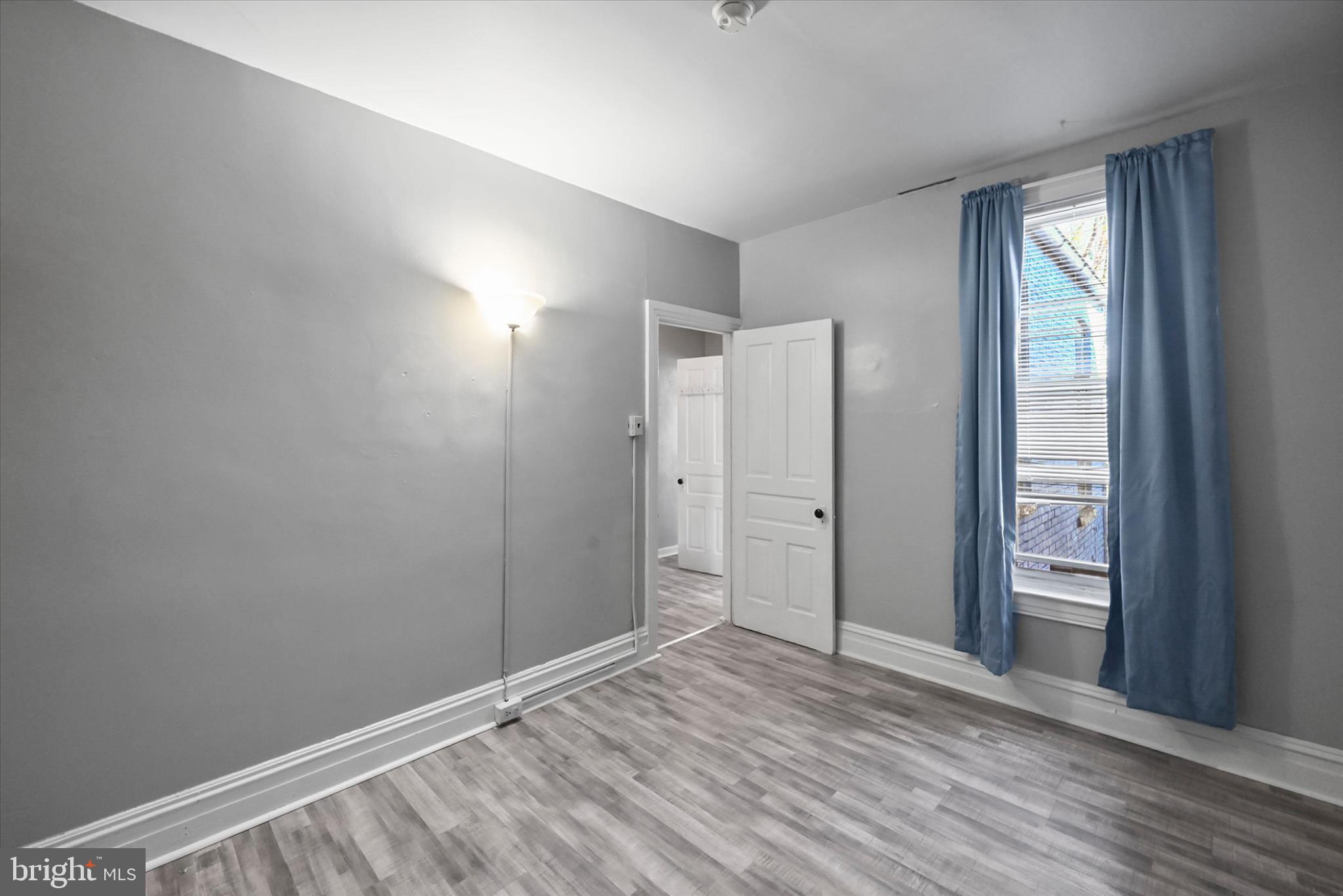 707 York Street York, PA 17403 - Photo 15 of 32 an empty room with closet and wooden floor