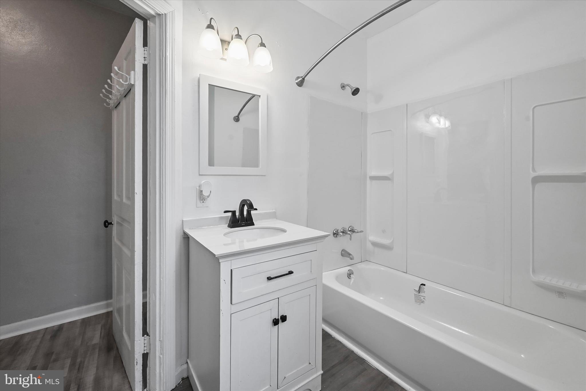 707 York Street York, PA 17403 - Photo 19 of 32 a view of bathroom with a tub sink mirror and vanity