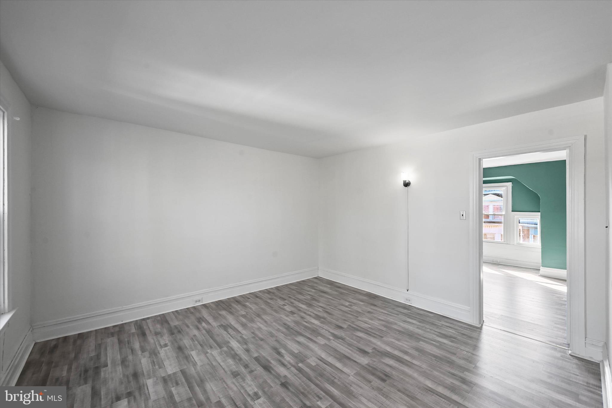 707 York Street York, PA 17403 - Photo 20 of 32 an empty room with wooden floor and windows