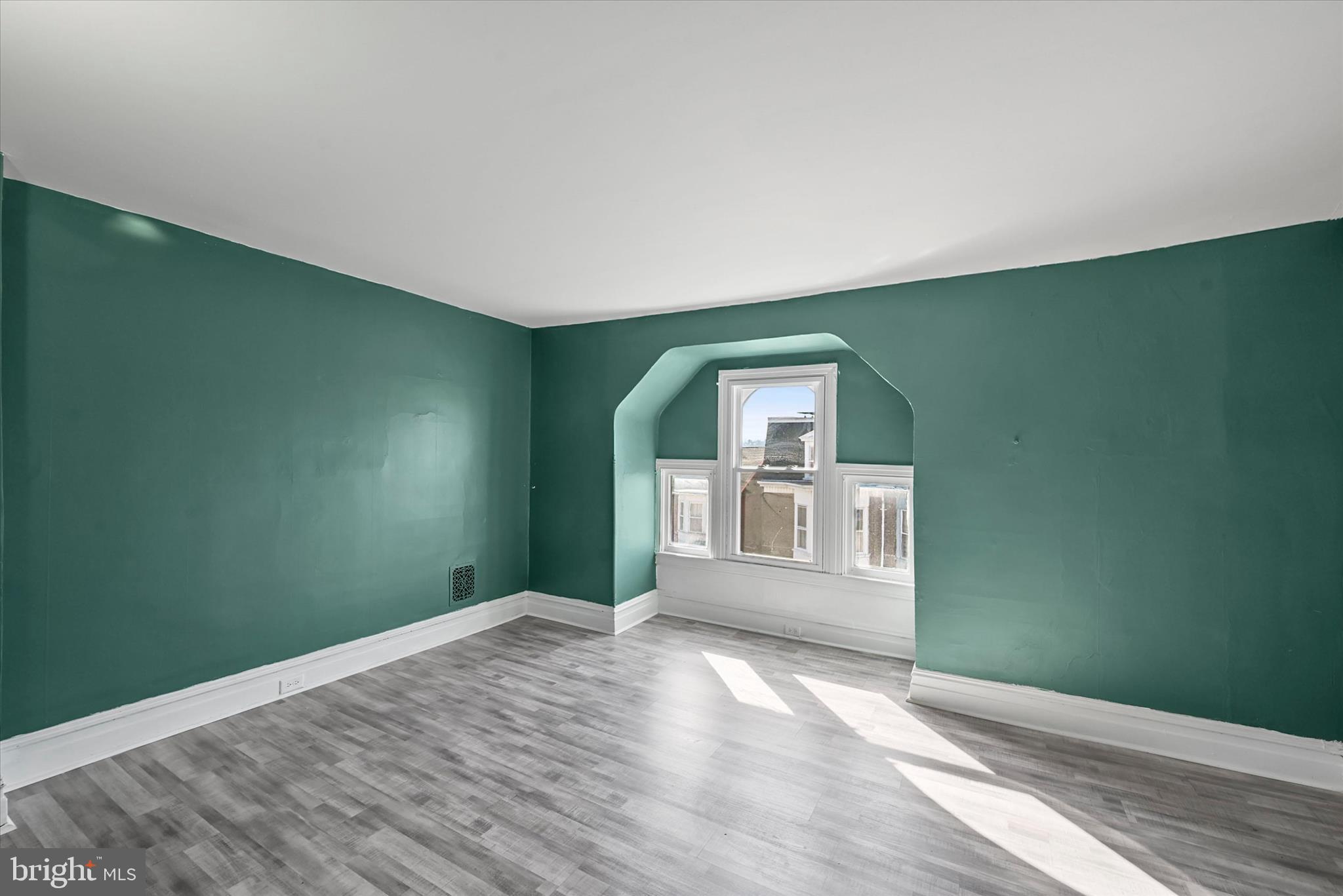 707 York Street York, PA 17403 - Photo 22 of 32 an empty room with wooden floor and windows