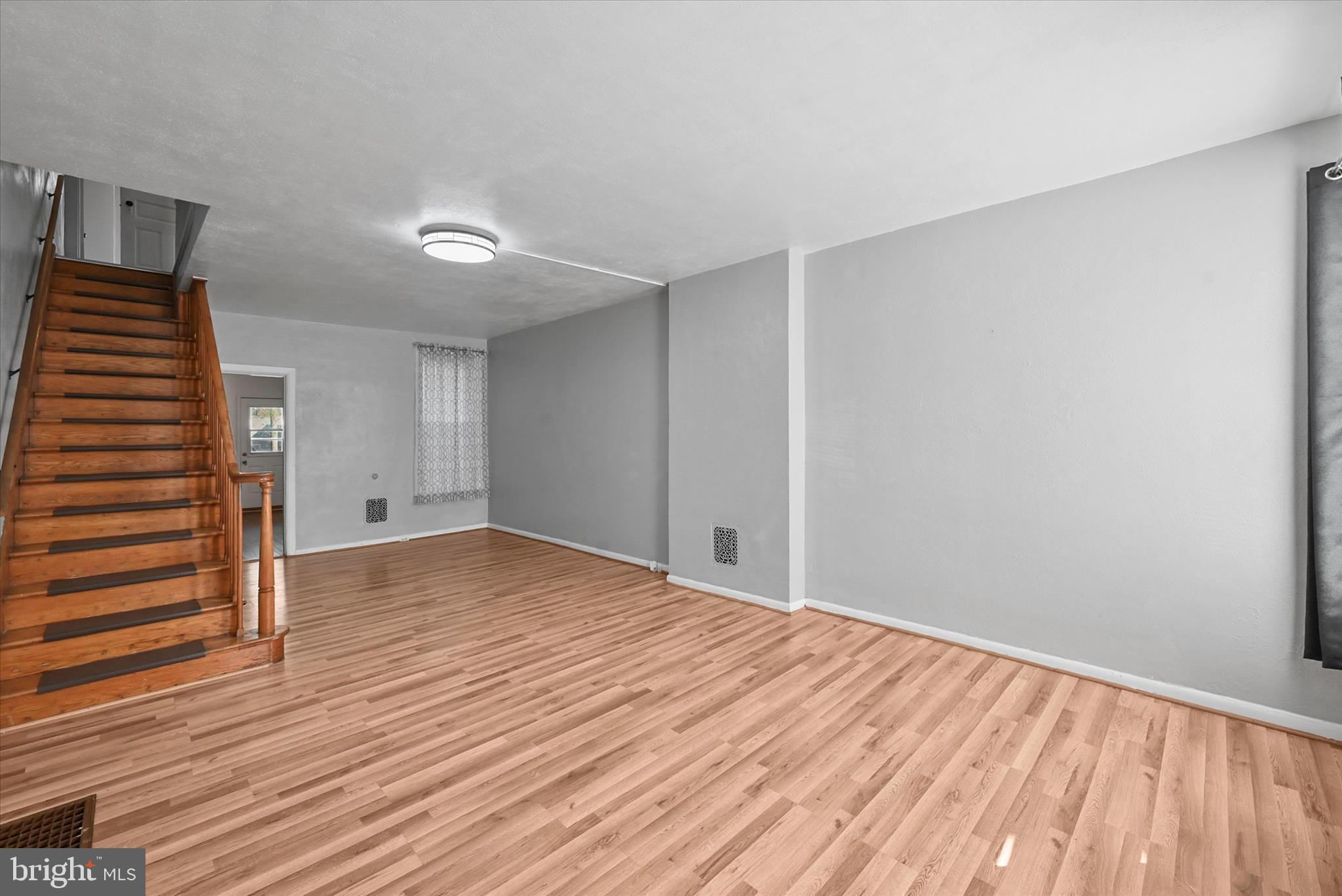 707 York Street York, PA 17403 - Photo 4 of 32 a view of empty room with wooden floor and fan