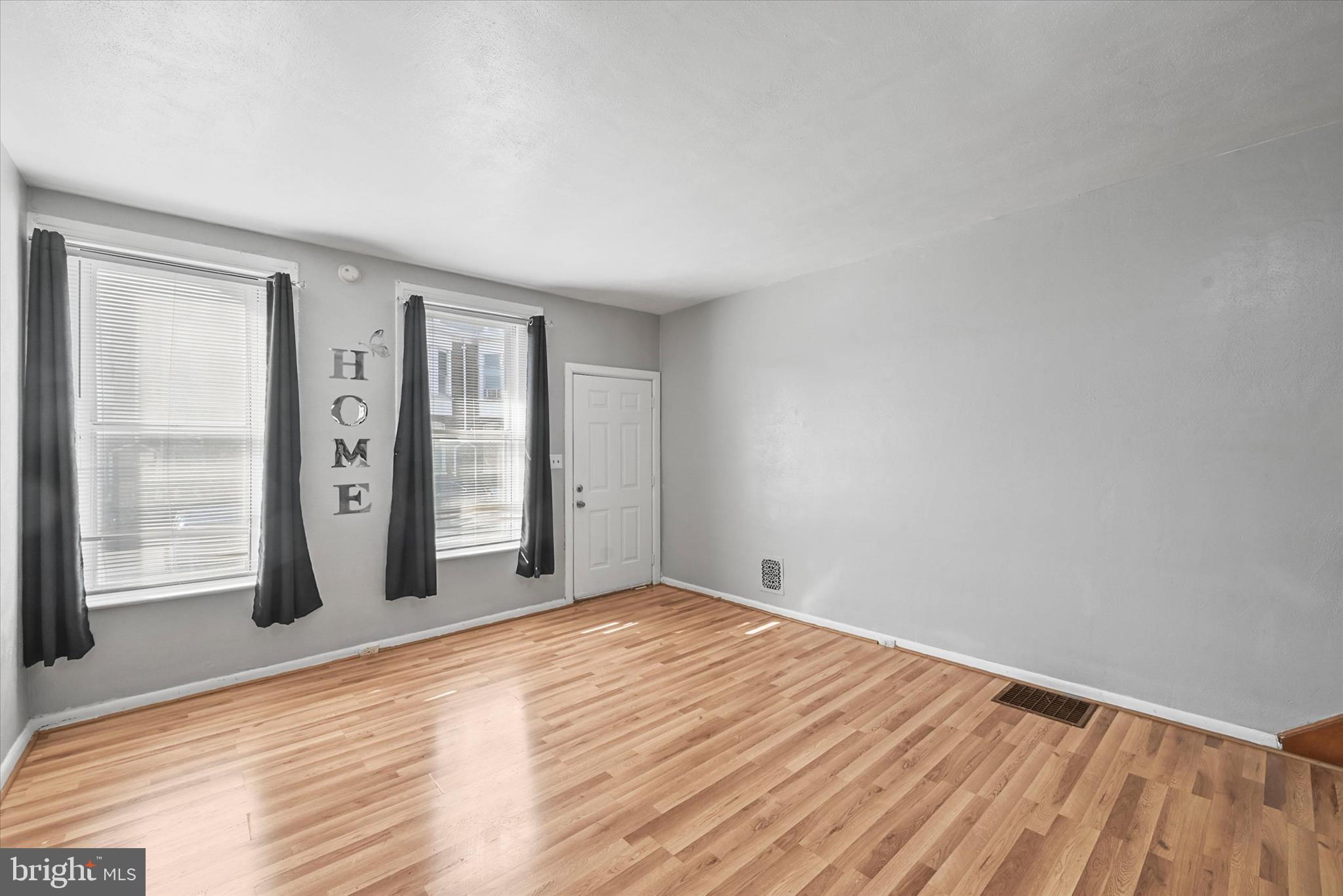 707 York Street York, PA 17403 - Photo 6 of 32 a view of an empty room with window and wooden floor