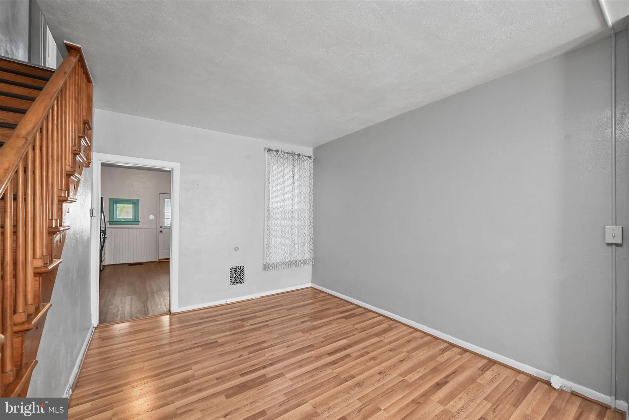 707 York Street York, PA 17403 - Photo 8 of 32 a view of an empty room with wooden floor and a window