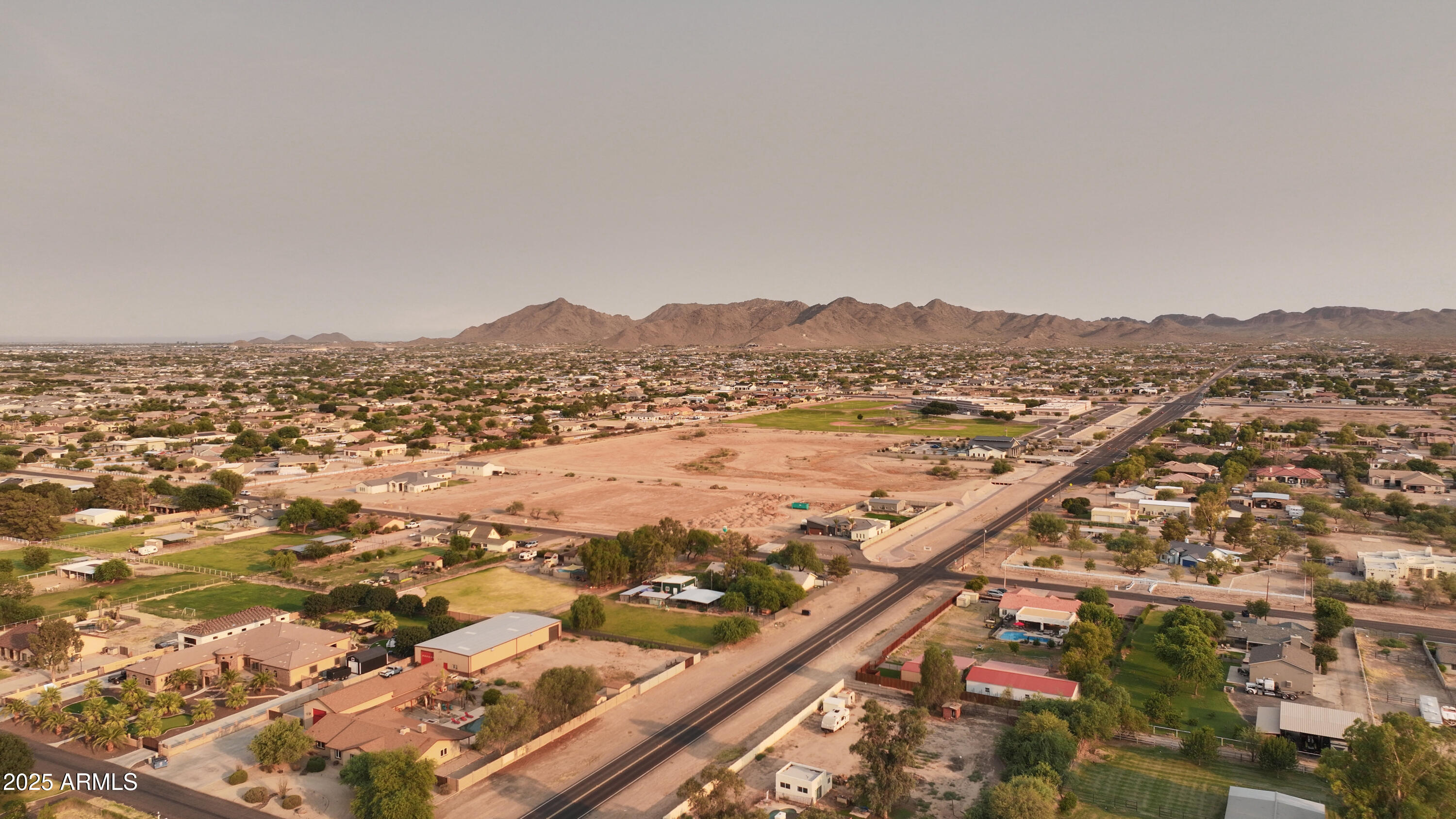 19215 East Cloud Road, Unit 2A Queen Creek, AZ 85142 - Photo 5 of 69 an aerial view of residential houses with outdoor space