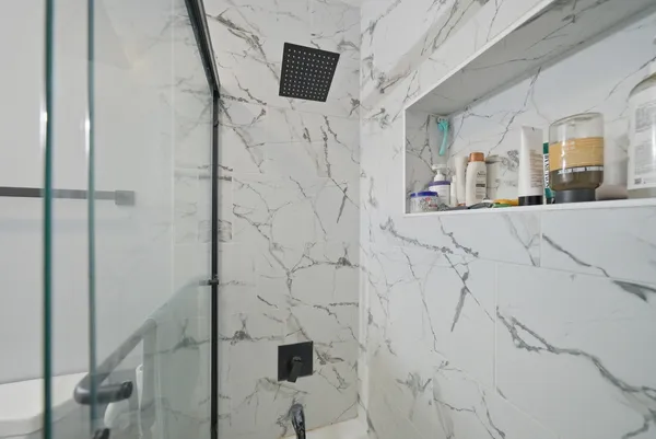 a view of a bathroom with shower