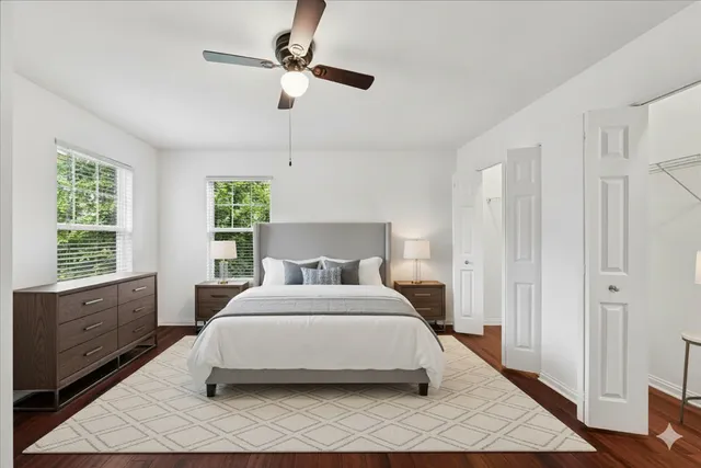 a bedroom with a large bed and a window