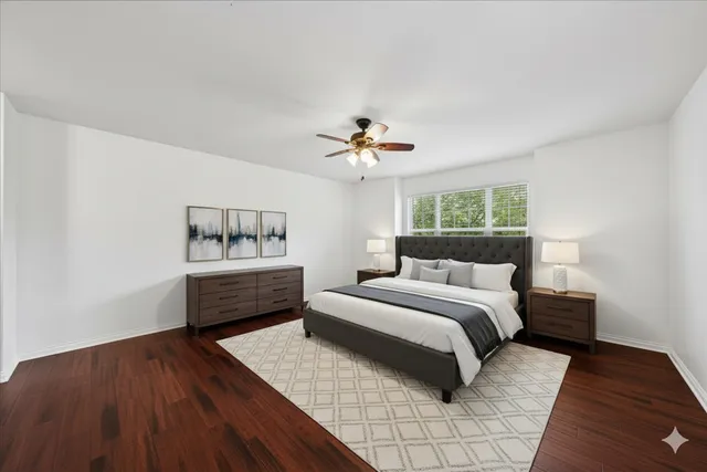 a spacious bedroom with a bed and a table