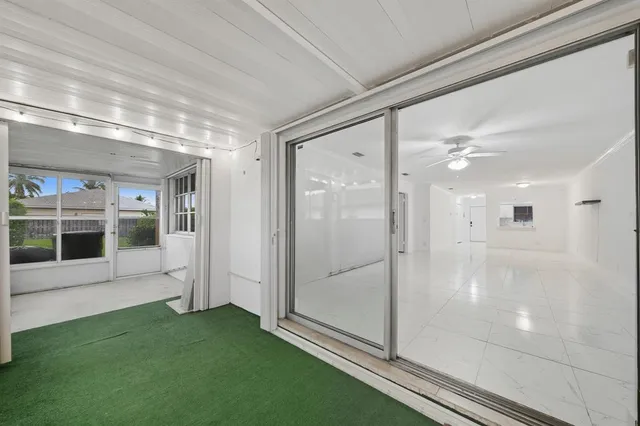 a view of a refrigerator in it and bathroom