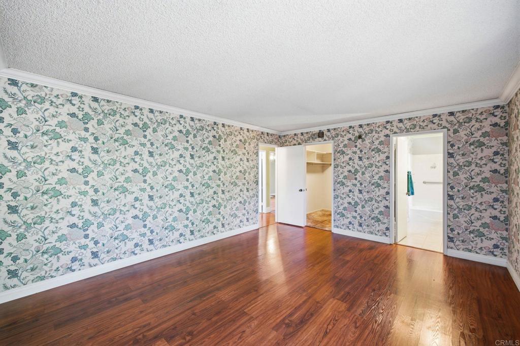 2807 South Grade Road Alpine, CA 91901 - Photo 23 of 42 a view of an empty room with wooden floor and a window