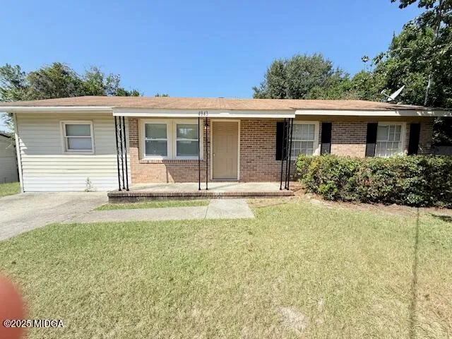 front view of a house with a yard