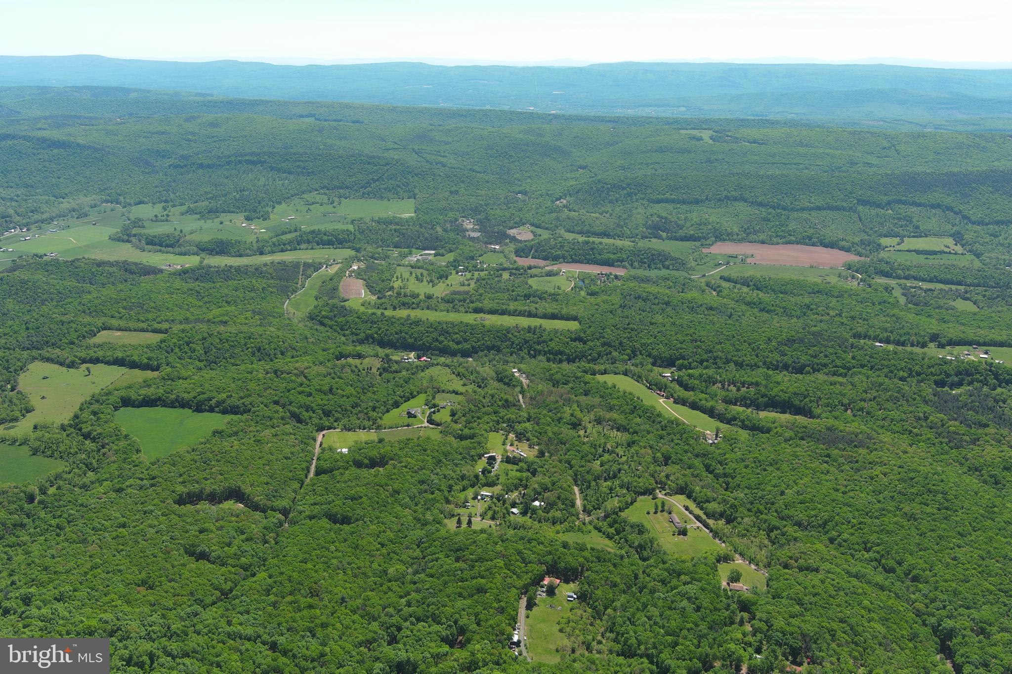 181 Deer Run Road Baker, WV 26801 - Photo 70 of 71 a view of a field with an ocean