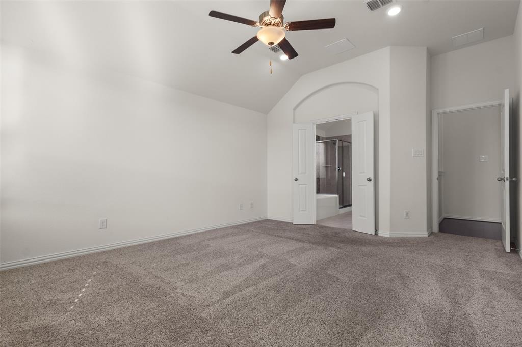 1740 Rio Costilla Road Fort Worth, TX 76131 - Photo 25 of 40 Carpeted flooring, vaulted ceiling, ceiling fan with integrated lighting, recessed lighting, and an arched entryway