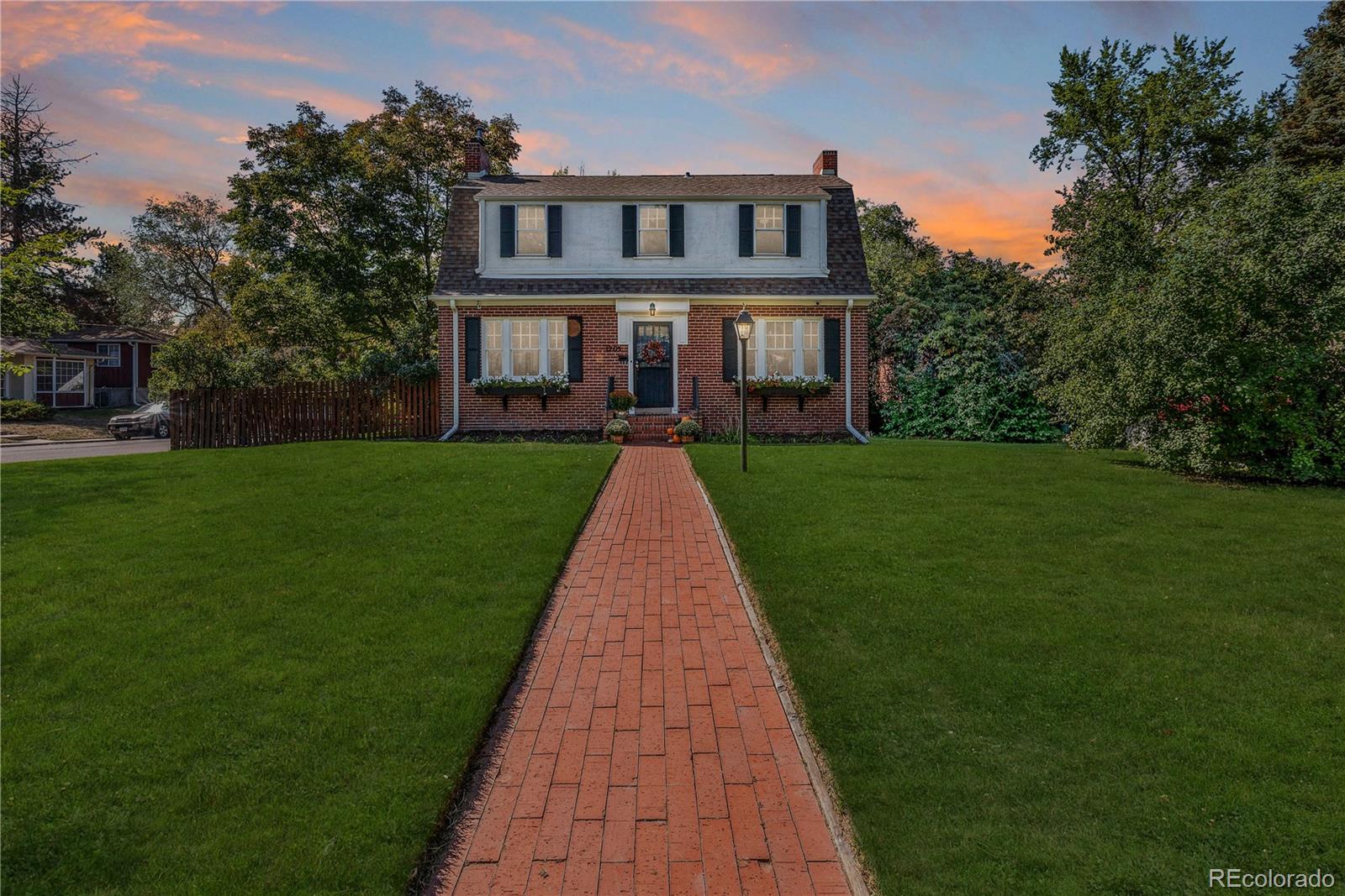 a front view of a house with yard