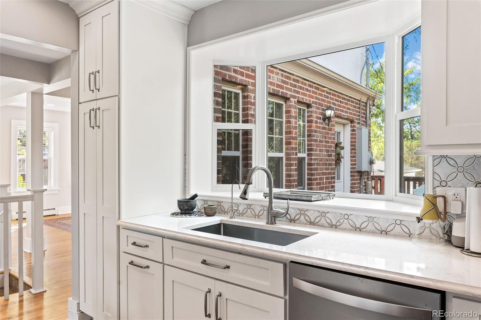 1205 Niagara Street Denver, CO 80220 - Photo 13 of 38 a bathroom with a sink and a window