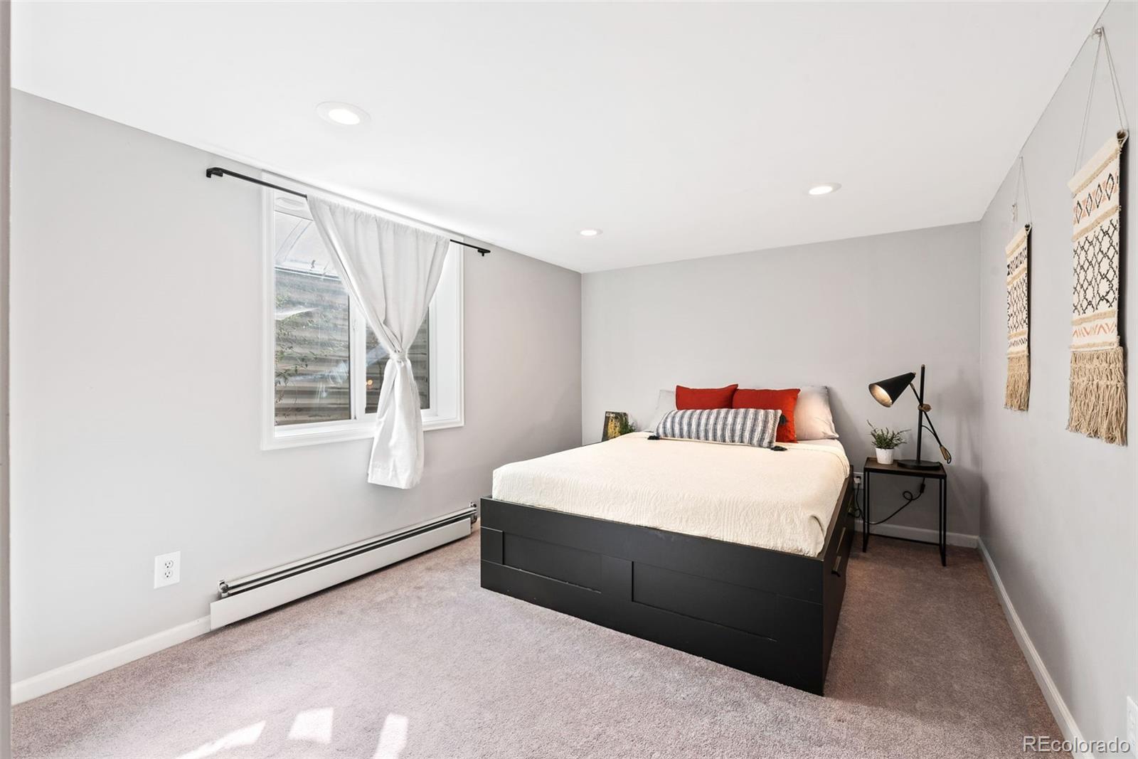 1205 Niagara Street Denver, CO 80220 - Photo 29 of 38 a bedroom with a bed and a window