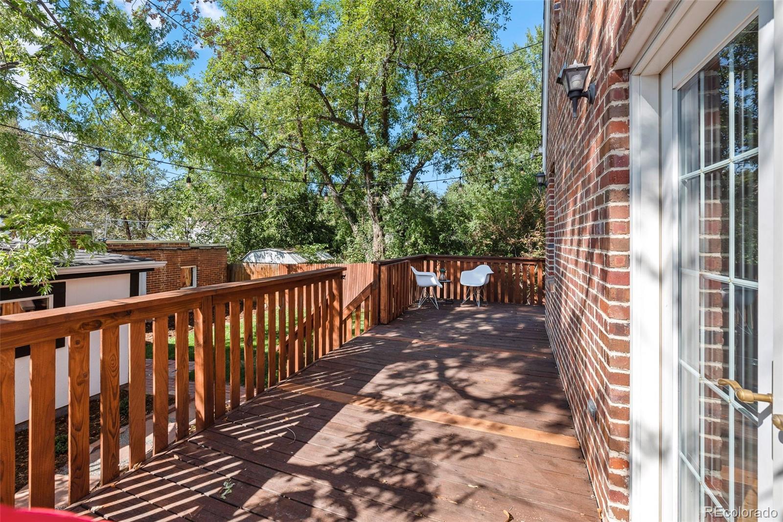 1205 Niagara Street Denver, CO 80220 - Photo 30 of 38 a view of a pathway of a house with backyard and deck