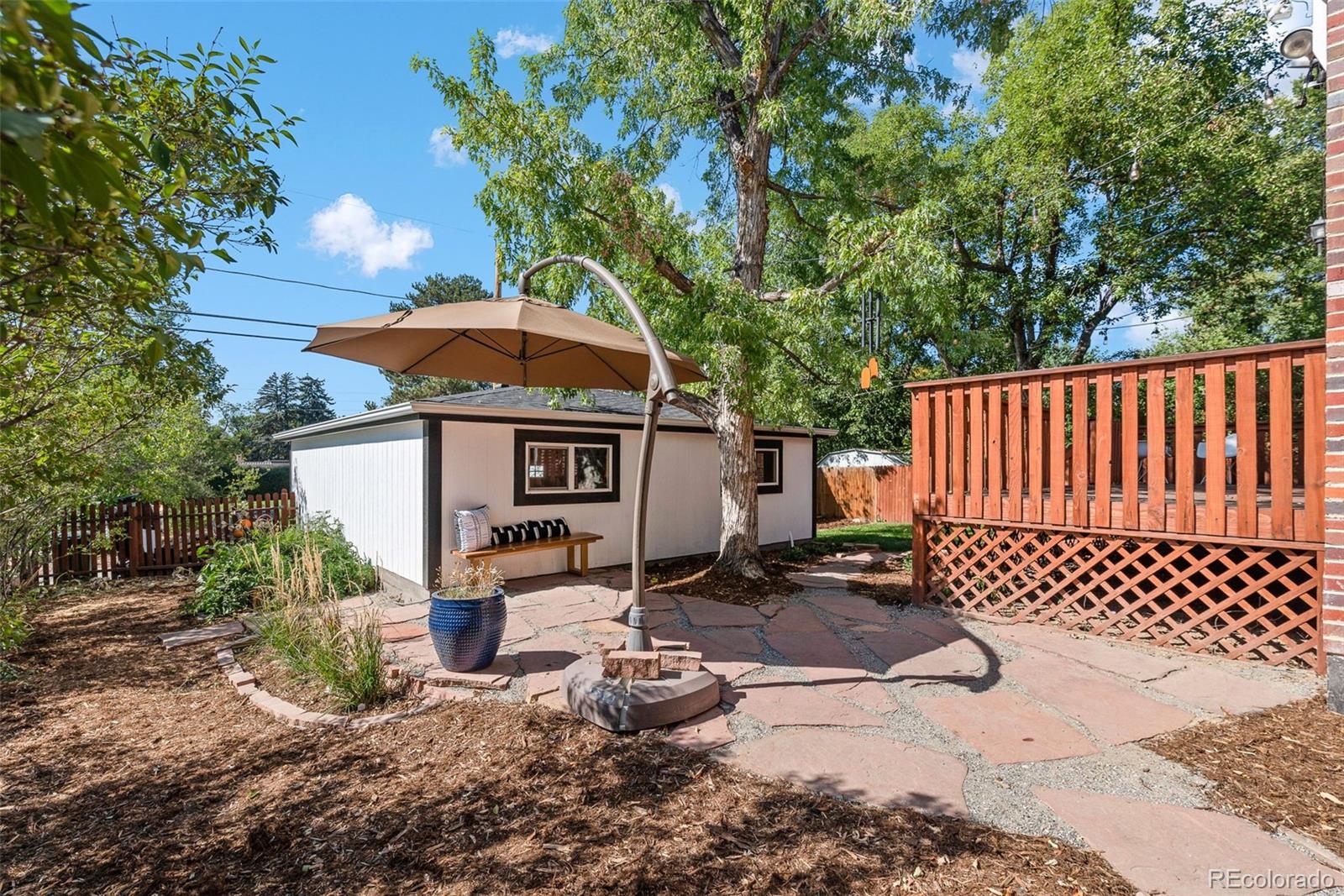 1205 Niagara Street Denver, CO 80220 - Photo 33 of 38 a front view of a house with a yard