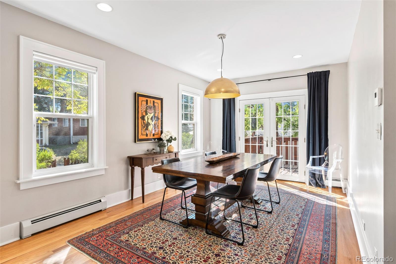 1205 Niagara Street Denver, CO 80220 - Photo 7 of 38 a view of a dining room with furniture window and outside view