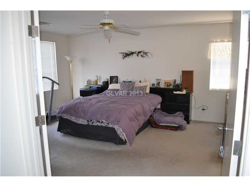 10158 Rice Paper Street Las Vegas, NV 89183 - Photo 12 of 24 Master Bedroom. Walk in Closet & French Doors