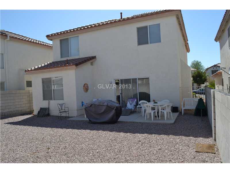10158 Rice Paper Street Las Vegas, NV 89183 - Photo 22 of 24 Exterior Back. Huge Backyard with Patio