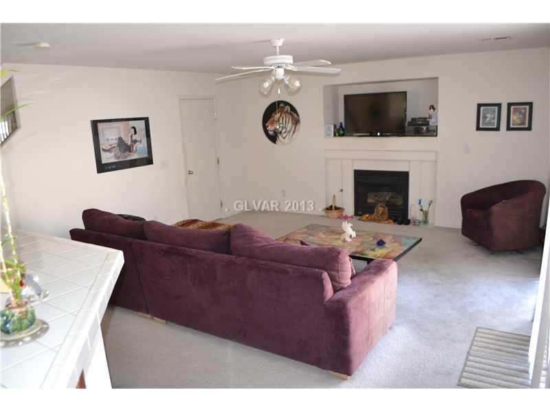 10158 Rice Paper Street Las Vegas, NV 89183 - Photo 7 of 24 Living Room. Gas Fireplace