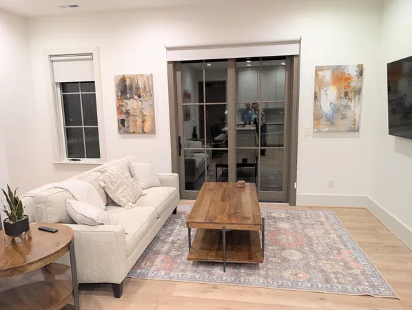 a living room with furniture and window