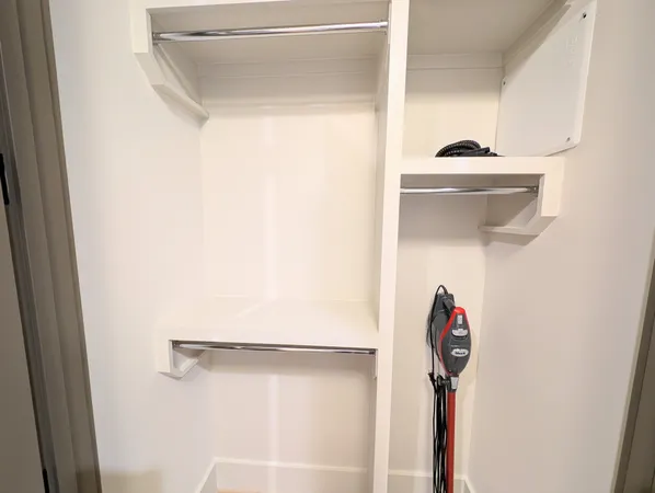 a bathroom with a shower and a sink