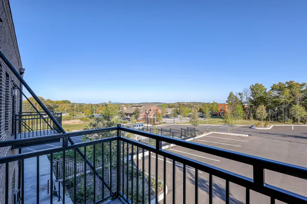 a view of a street from a balcony