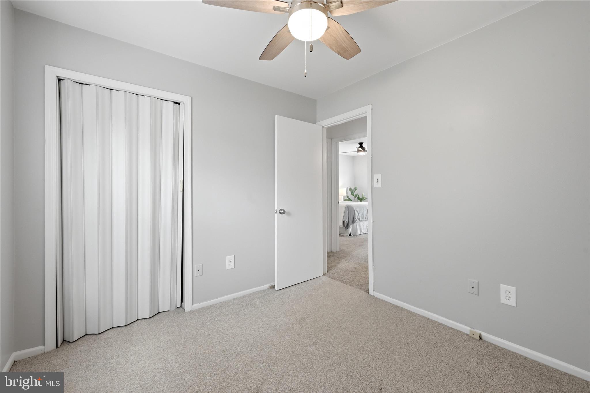 5446 Lighthouse Lane Burke, VA 22015 - Photo 18 of 36 an empty room with chandelier fan