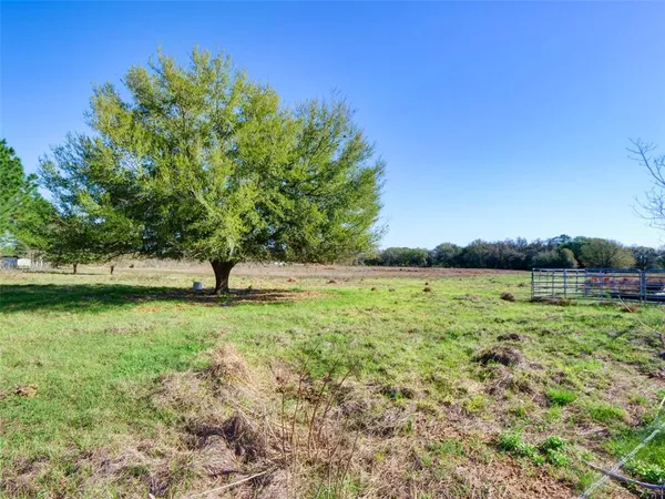 a view of outdoor space with deck and yard