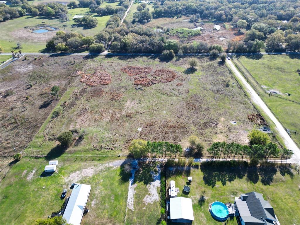 0 614a Bushnell, FL 33513 - Photo 11 of 19 a view of a lake with a mountain in the background