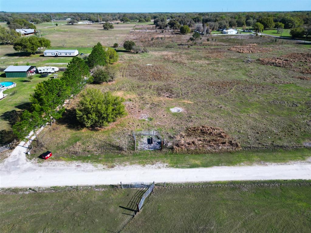 0 614a Bushnell, FL 33513 - Photo 14 of 19 an aerial view of a house with a yard and lake view