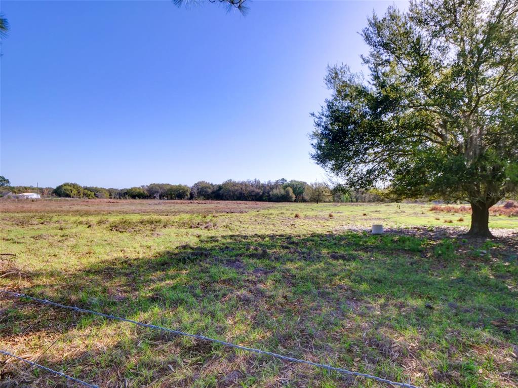 0 614a Bushnell, FL 33513 - Photo 2 of 19 a view of a lake with houses in the back