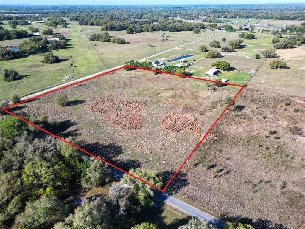 0 614a Bushnell, FL 33513 - Photo 8 of 19 an aerial view of a house with a yard and lake view