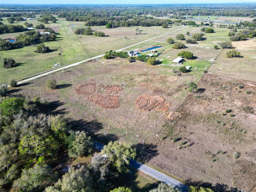 0 614a Bushnell, FL 33513 - Photo 9 of 19 an aerial view of a houses with a yard