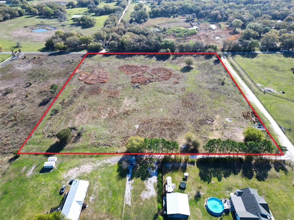 0 614a Bushnell, FL 33513 - Photo 10 of 19 an aerial view of a house with a yard basket ball court and outdoor seating