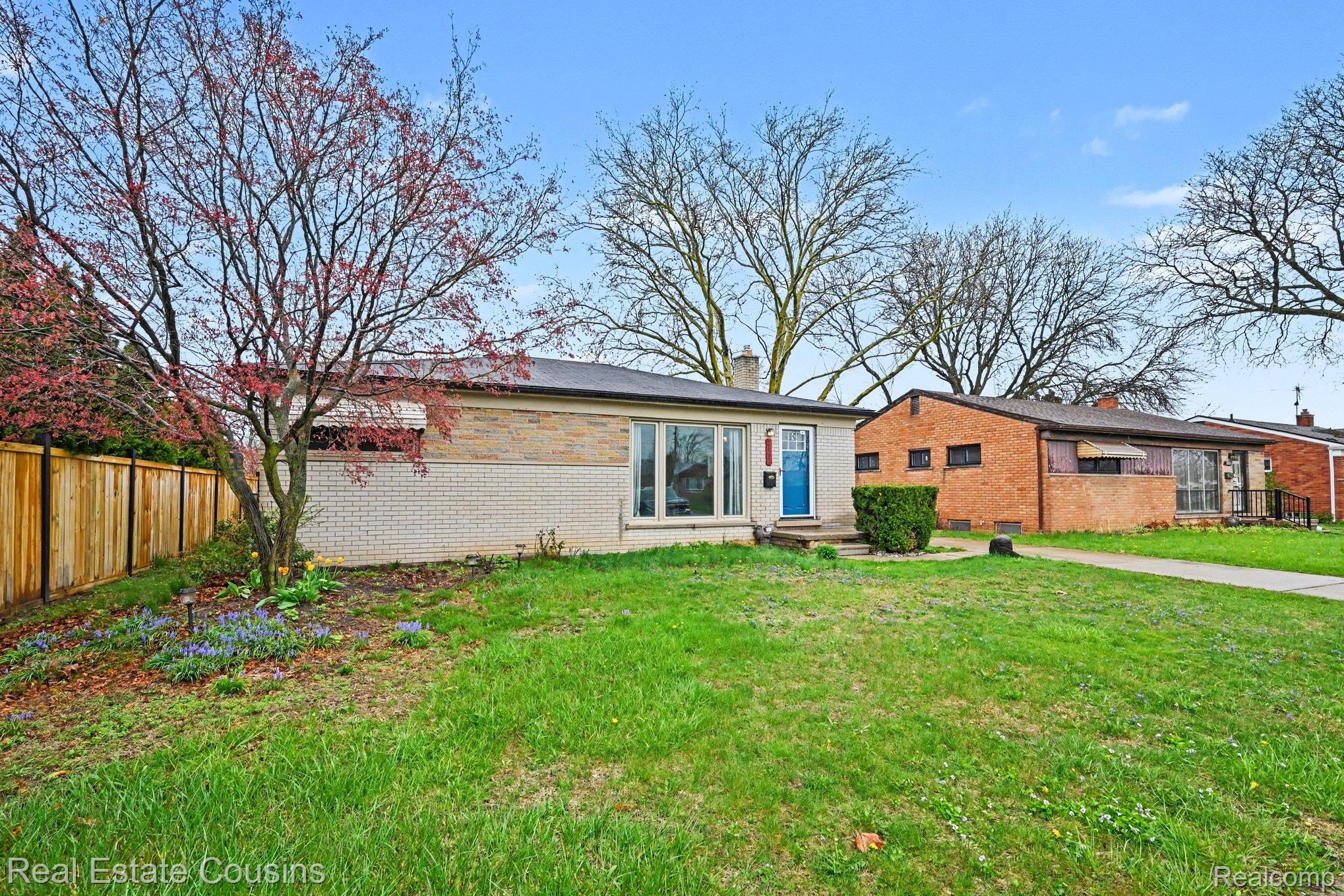 32224 Joy Road Livonia, MI 48150 - Photo 3 of 33 Rear view of house with brick siding and a chimney