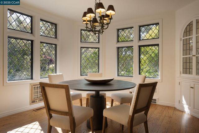 a living room with furniture a fireplace and a large window