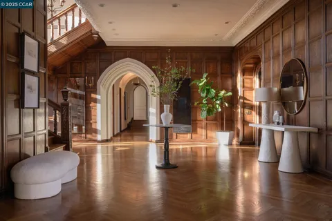 a bedroom with a large bed and a large window