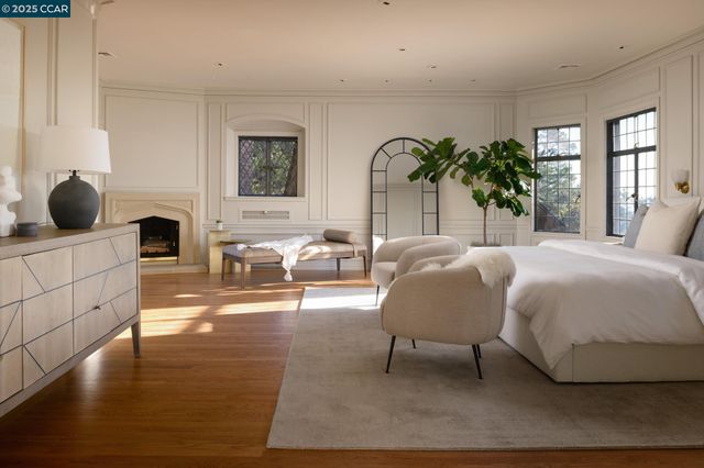 a spacious bathroom with a granite countertop tub sink a mirror a shower and vanity