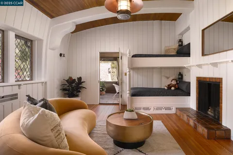 a spacious bedroom with a bed and a large window