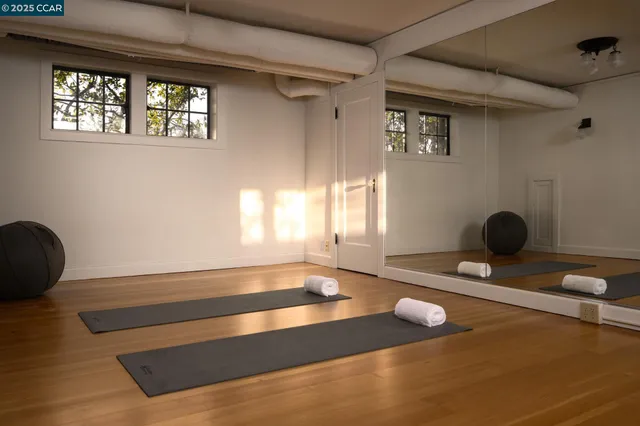 a view of house with yard and seating area