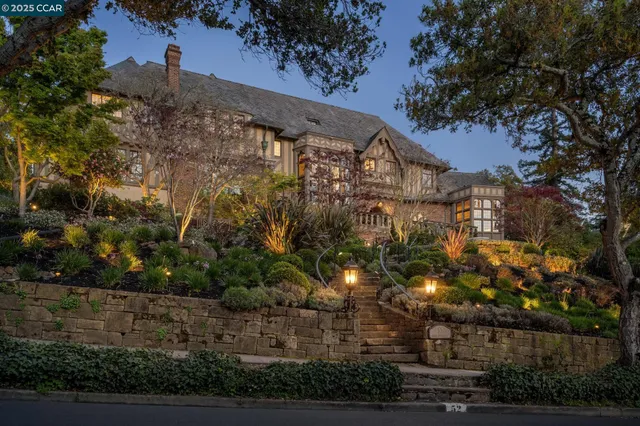 a view of house with yard and outdoor seating