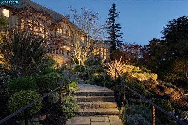 a house view with a sitting space fire pit and outdoor space