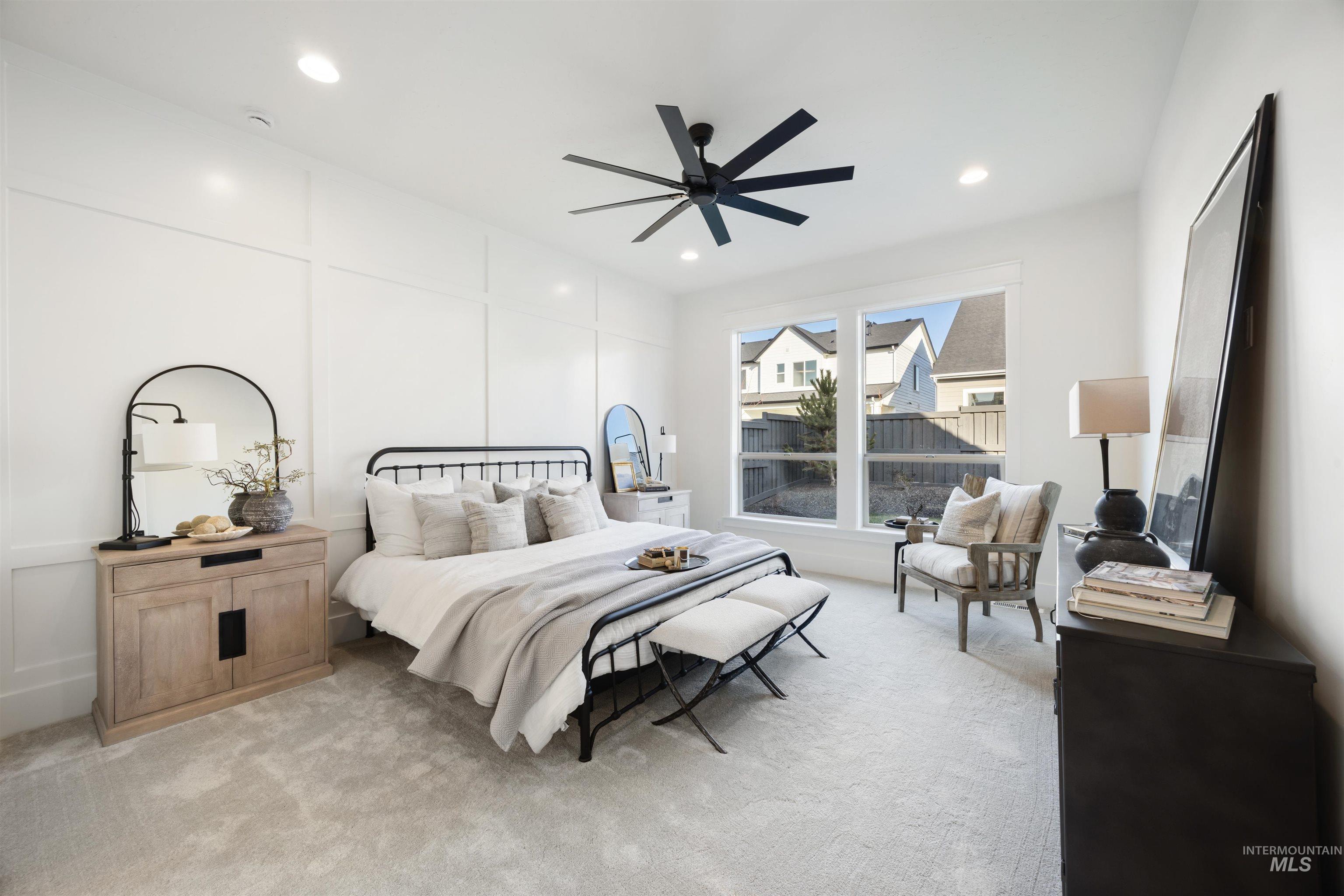 1034 East Escalation Street Meridian, ID 83642 - Photo 19 of 40 Bedroom featuring light colored carpet, a decorative wall, a ceiling fan, and recessed lighting