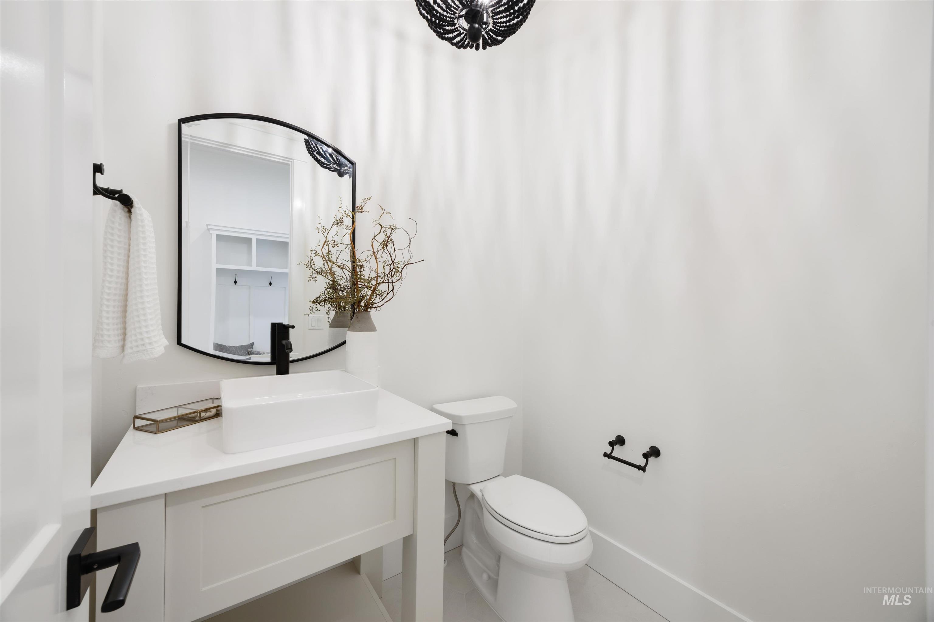 1034 East Escalation Street Meridian, ID 83642 - Photo 30 of 40 Half bath featuring toilet and vanity