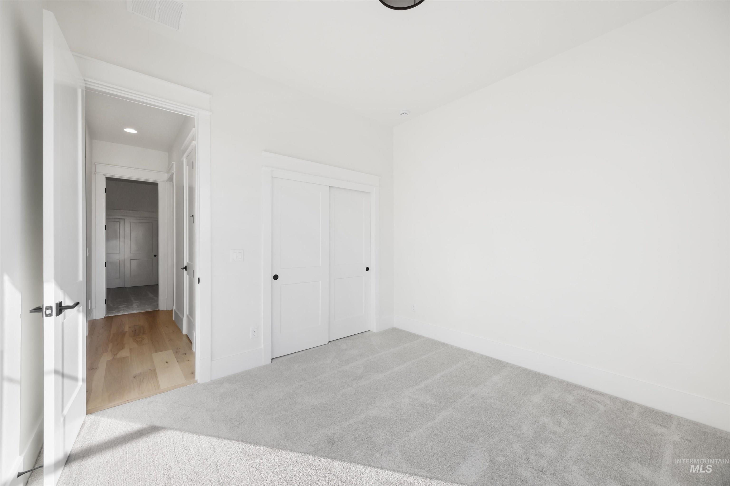 1034 East Escalation Street Meridian, ID 83642 - Photo 33 of 40 Unfurnished bedroom featuring light colored carpet and a closet